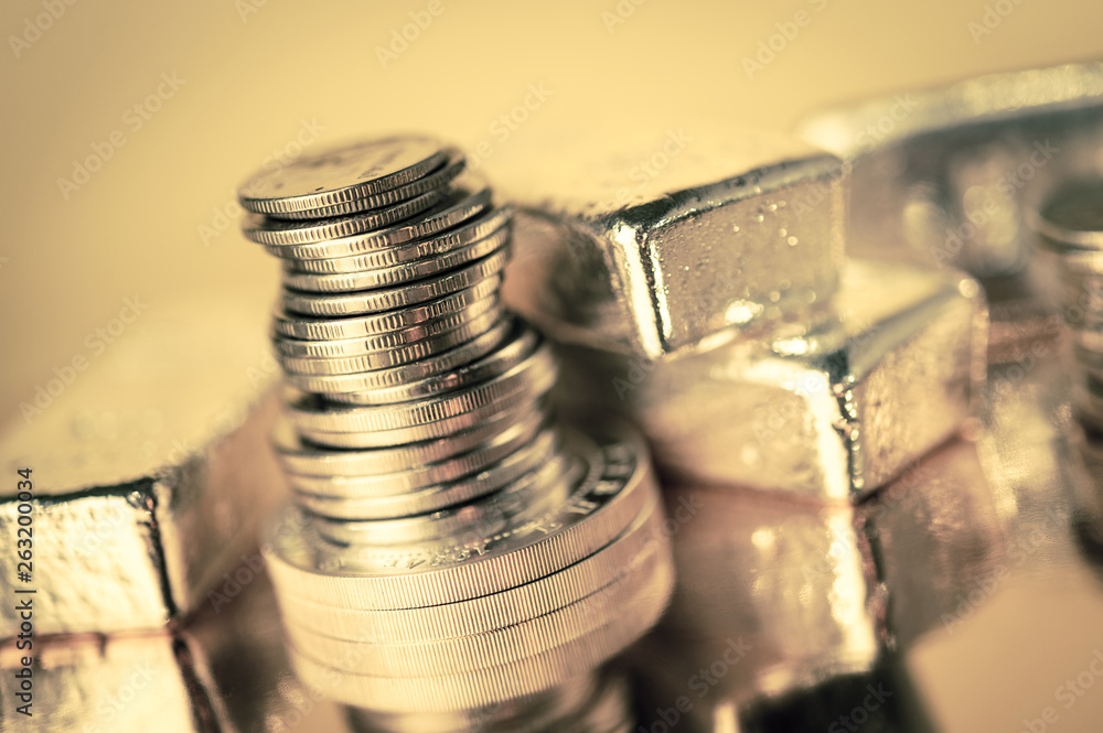 Gold bars and stack of gold coins. Background for finance banking concept. Trade in precious metals. Gold bars and stack of gold coins. Background for finance banking concept. Trade in precious metals.