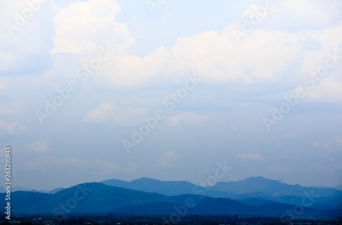 landscape with mountains and clouds, blue tone.
