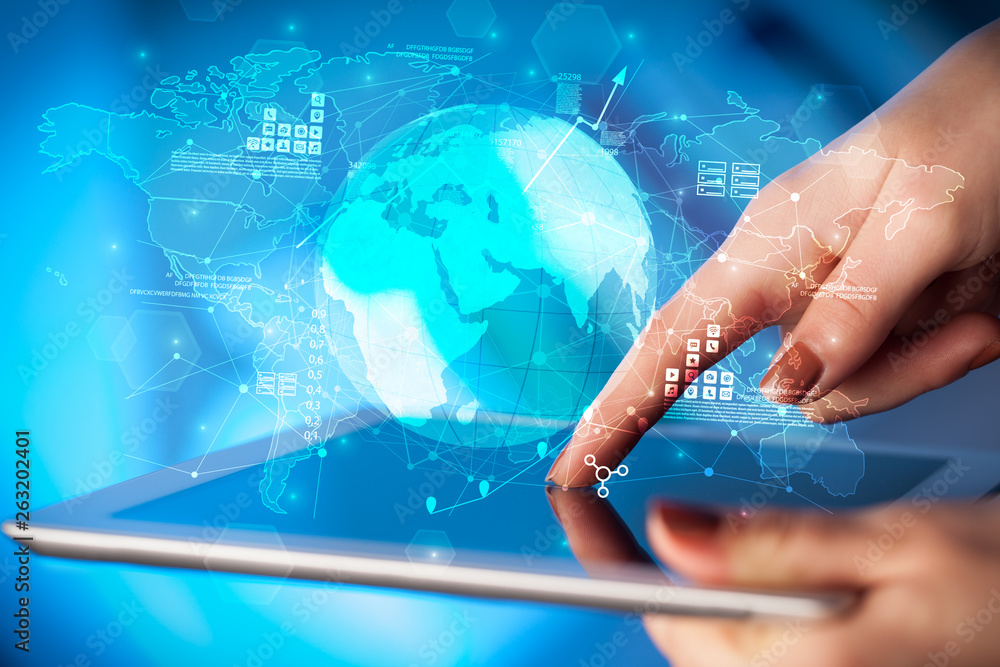 Hand using tablet with multinational worldwide estate report concept
