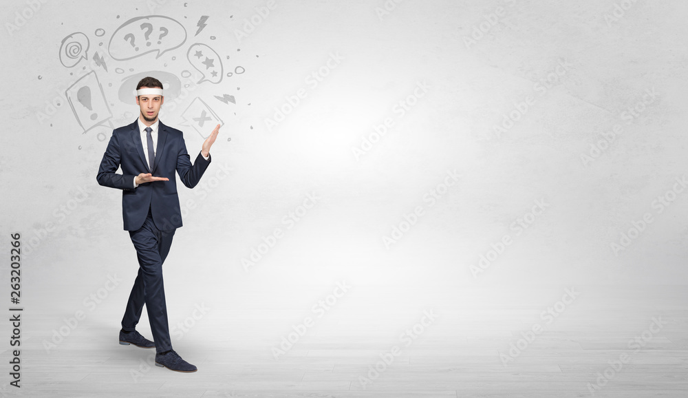 Young businessman in suit fighting with doodled symbols concept
Young businessman in suit fighting with doodled symbols concept