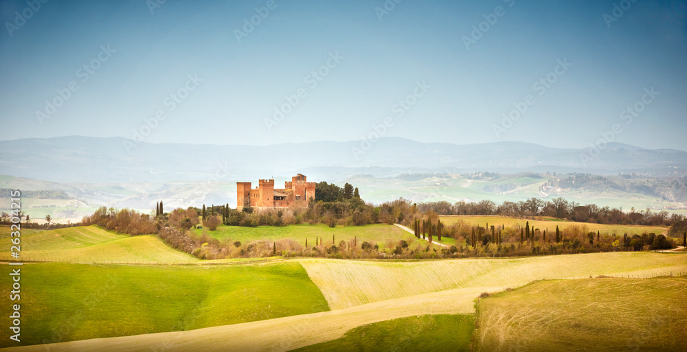 View of Castle of Gallico. Beautiful landscape of hills and fields near Asciano in Tuscany, Siena, Italy