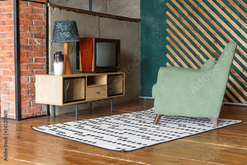 Vintage room with carpet, old fashioned armchair, retro tv, tv stand, vase and standart lamp. Retro interior