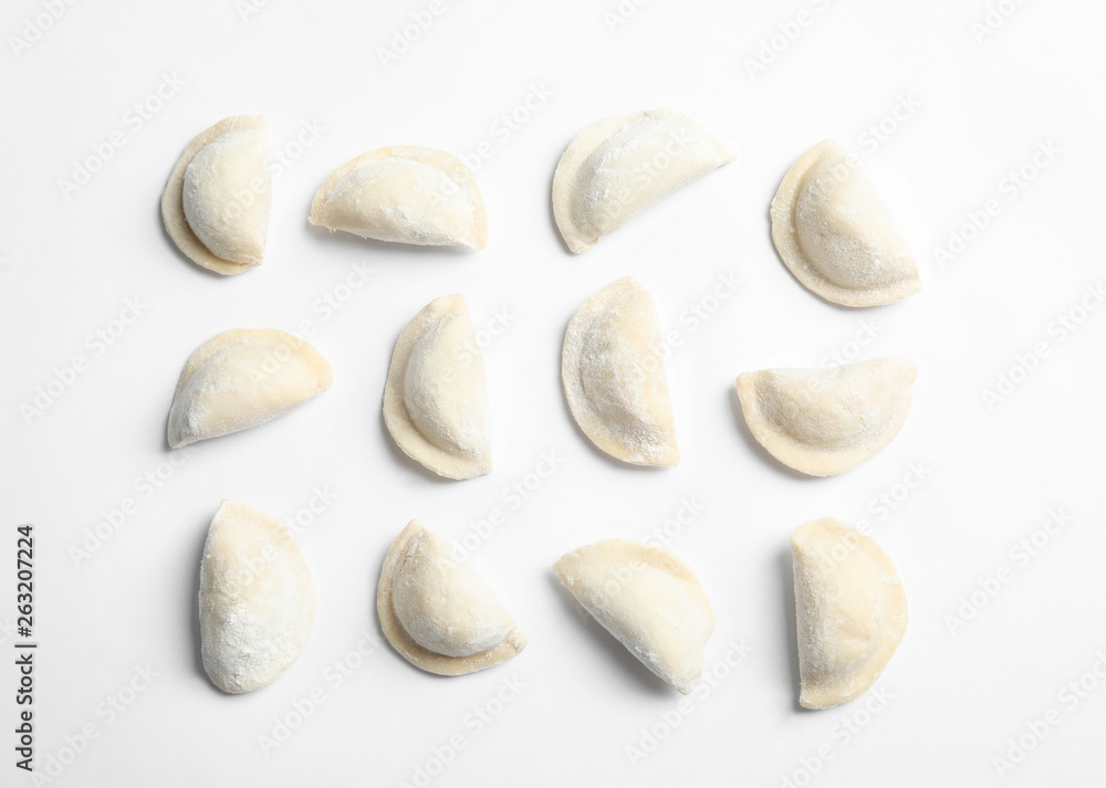 Raw dumplings on white background, top view. Home cooking