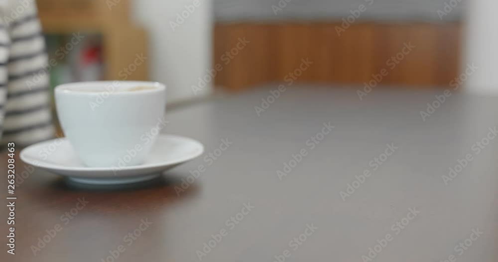 Woman buy a cup of coffee with credit card payment on pos terminal Woman buy a cup of coffee with credit card payment on pos terminal