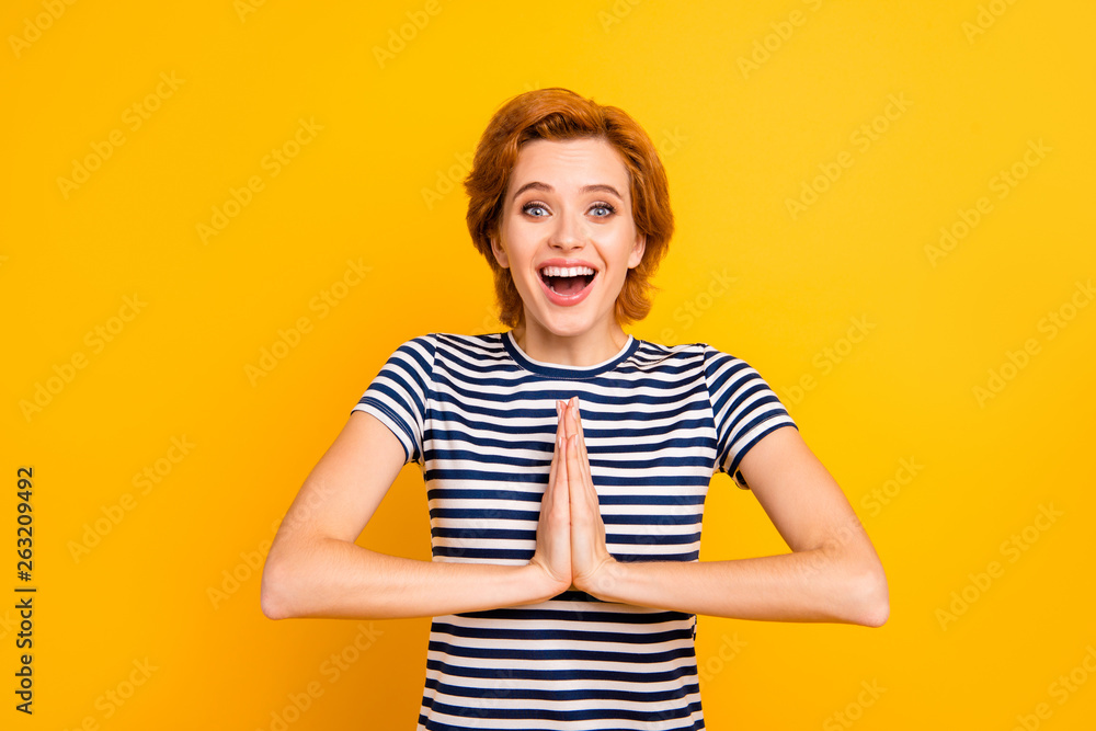 Close up photo beautiful amazing she her lady eyes closed hands arms together praying free vacation trip wear casual striped white blue t-shirt outfit clothes isolated yellow bright vivid background Close up photo beautiful amazing she her lady eyes closed hands arms together praying free vacation trip wear casual striped white blue t-shirt outfit clothes isolated yellow bright vivid background