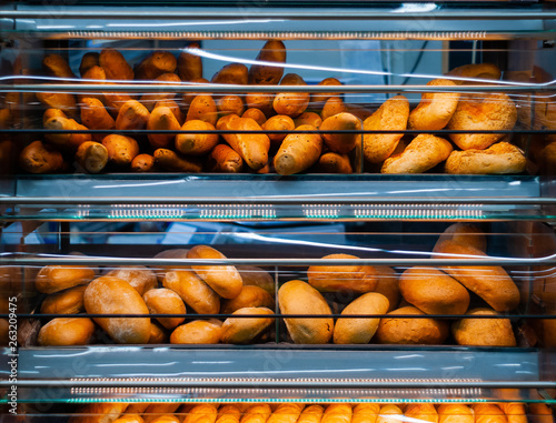 background - shelves with fresh bread in a grocery store