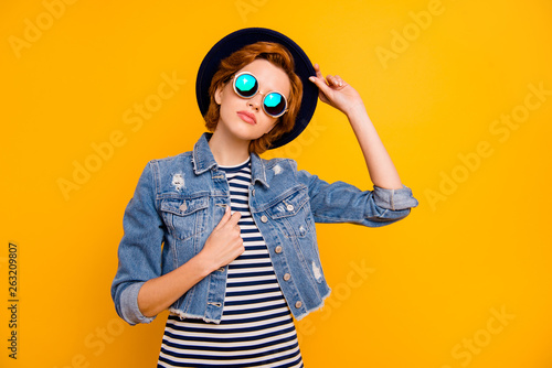 Close up photo beautiful she her lady arm hand traveler perfect modern look self-confident wear specs vintage hat casual striped t-shirt jacket jeans denim isolated yellow bright vivid background