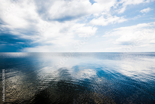 Fototapeta Naklejka Na Ścianę i Meble -  A view of the Baltic sea against cloudy blue sky, Latvia