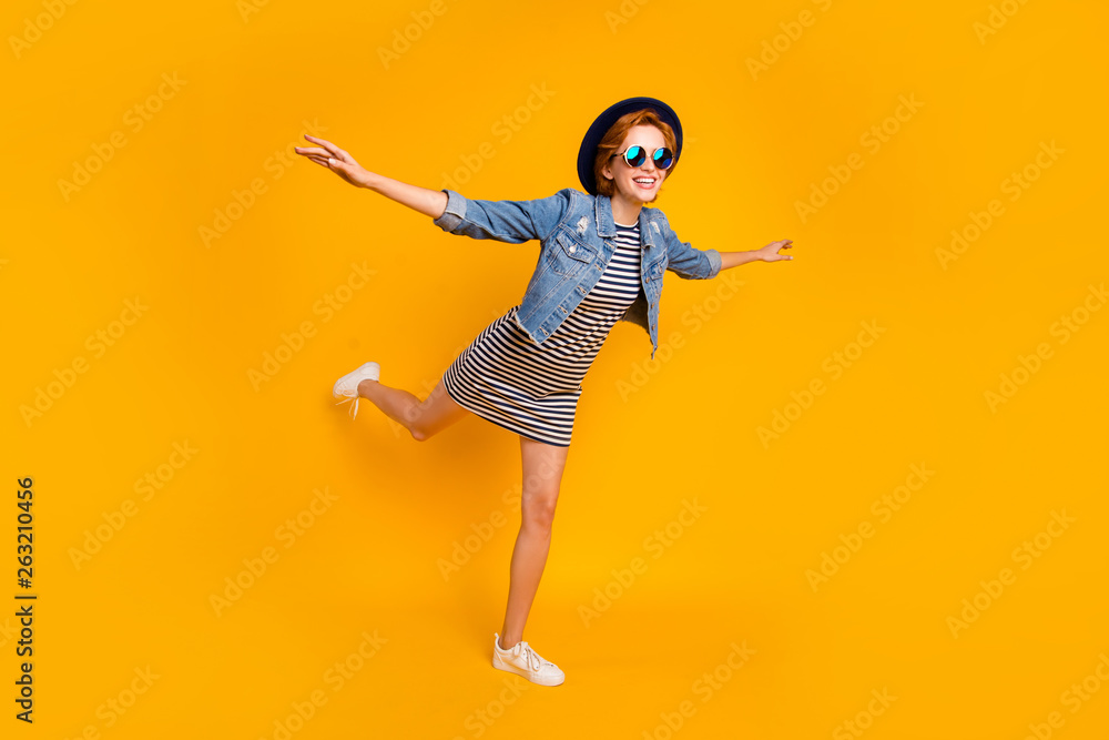 Full length body size view portrait of nice pretty lovely charming attractive cheerful cheery optimistic girl flying on air like plane free time isolated over bright vivid shine yellow background Full length body size view portrait of nice pretty lovely charming attractive cheerful cheery optimistic girl flying on air like plane free time isolated over bright vivid shine yellow background