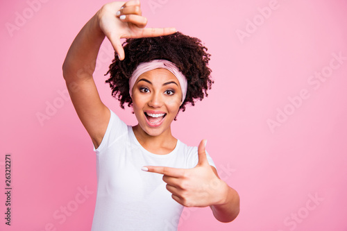Close up photo beautiful amazing she her dark skin model lady arms hands forefingers taking shot portrait photographer cheerful wear head scarf casual white t-shirt isolated pink bright background