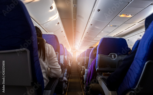 Passengers sitting inside airplane While traveling by plane