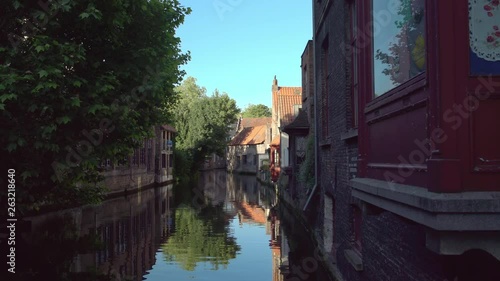 Beautiful houses along calm canal in Bruges, Belgium. photo