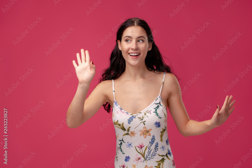 Portrait of beautiful happy young brunette woman and greeting gesture Portrait of beautiful happy young brunette woman and greeting gesture