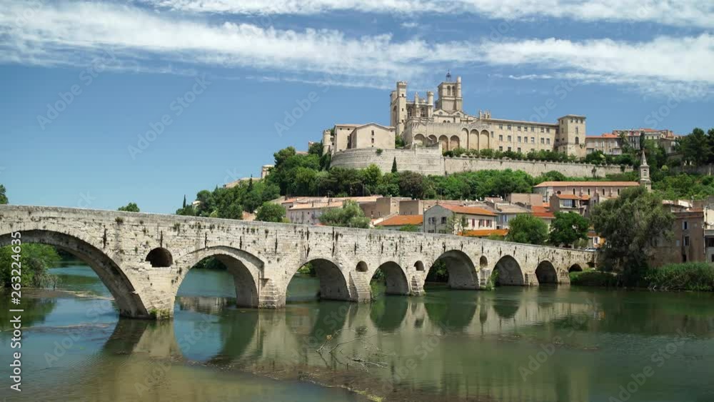 Beziers cityscape with old bridge and Saint Nazaire cathedral on the Orb river in Beziers, France. Beziers cityscape with old bridge and Saint Nazaire cathedral on the Orb river in Beziers, France.