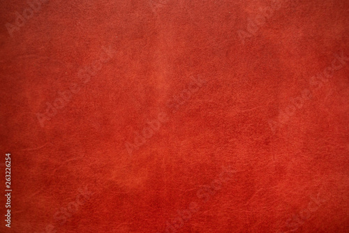 Abstract background of genuine red cartier leather