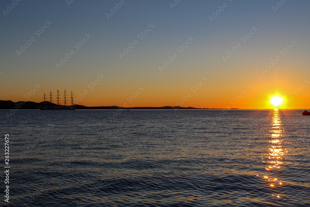 Sailing ship anchors in the sunset off the coast of Zadar, Croatia