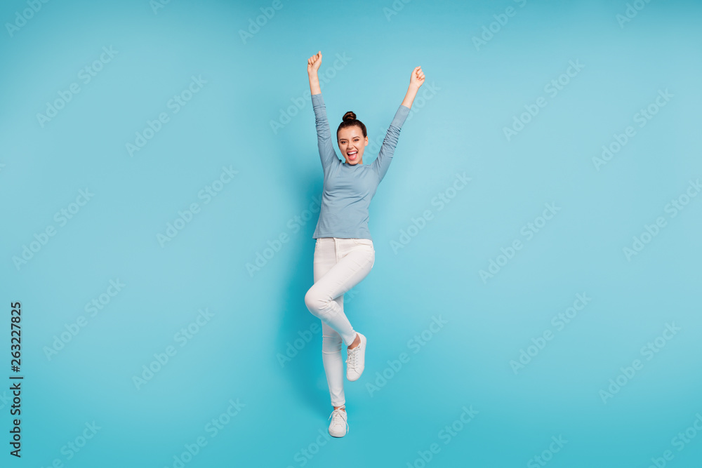 Fototapeta premium Full length body size photo beautiful amazing she her lady funny stylish hairstyle raise hands arms up roar yell party birthday wear casual white pants sweater pullover isolated blue bright background