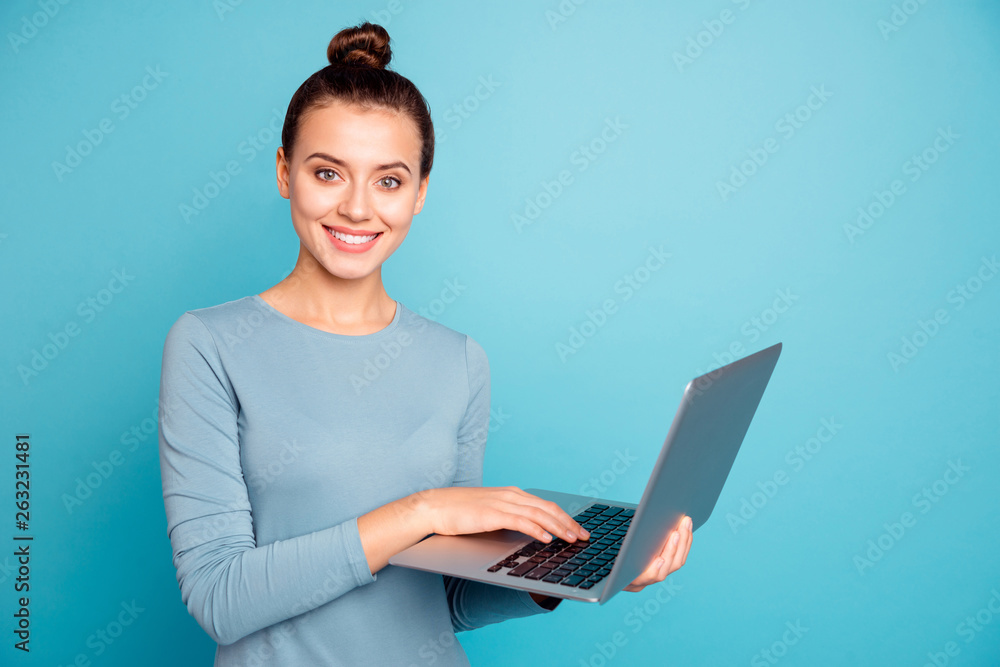 Portrait of cute charming youngster have modern technology satisfied candid content search news feed apps programs devices dressed modern cotton clothing isolated on blue background Portrait of cute charming youngster have modern technology satisfied candid content search news feed apps programs devices dressed modern cotton clothing isolated on blue background