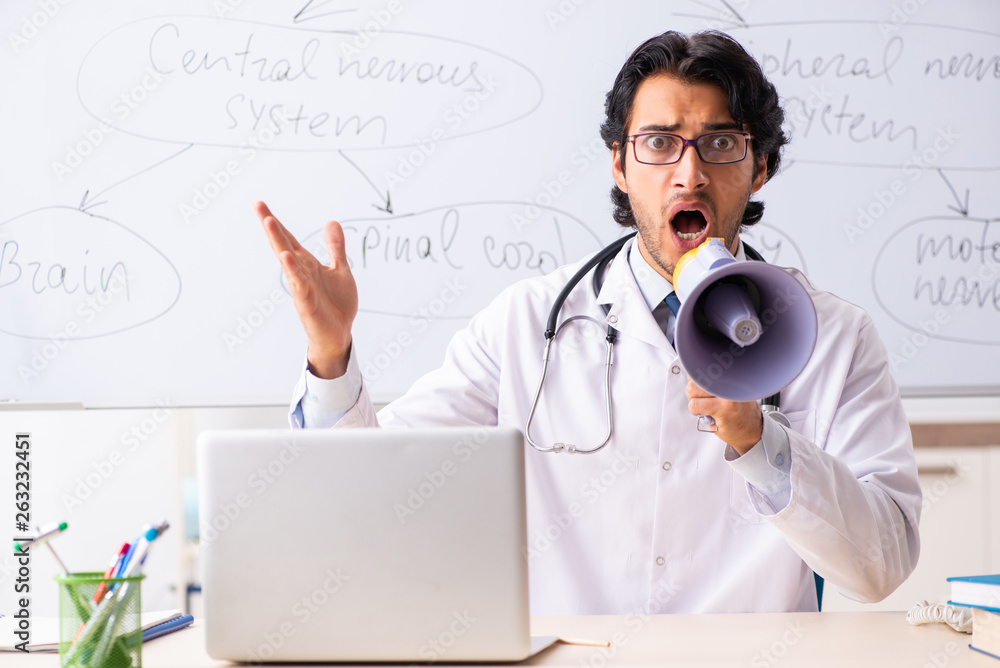 Young male doctor neurologist in front of whiteboard Young male doctor neurologist in front of whiteboard
