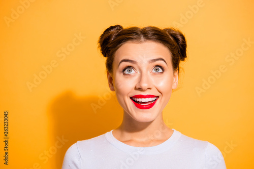 Close-up portrait of her she nice attractive lovely sweet cheerful cheery creative genius girl looking up news isolated over bright vivid shine yellow background