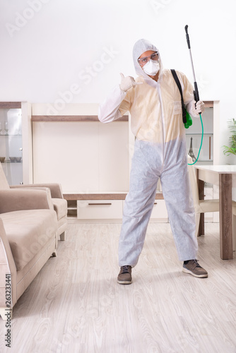 Pest control contractor working in the flat 