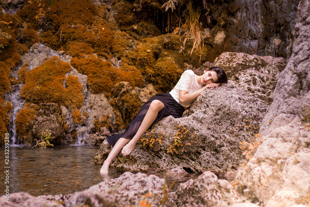 Beautiful girl posing in river, fairy fast forest in autumn. Beauty, fashion. Spa, healthcare. Tropical vacation. Natural pool. Beautiful girl posing in river, fairy fast forest in autumn. Beauty, fashion. Spa, healthcare. Tropical vacation. Natural pool.