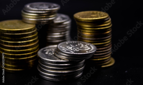 Wallpaper Mural Coins stack on black background in concept wall and strong money. Torontodigital.ca