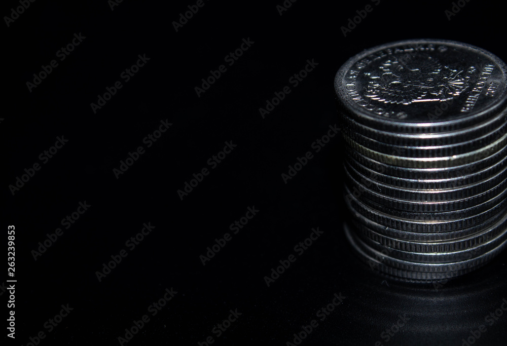 Coins stack on black background in concept wall and strong money. Coins stack on black background in concept wall and strong money.
