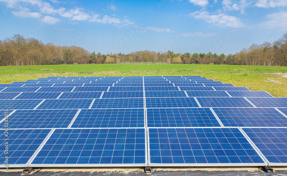 Dutch landscape with blue solar panels field Dutch landscape with blue solar panels field
