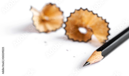 A pencil and a piece of a pencil on white paper background. Copy space for your text or image. photo