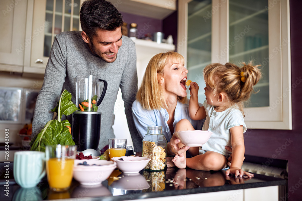 Girl feeding her mother in the morning