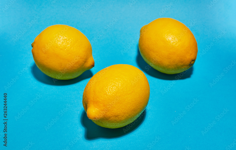 Lemon on blue background. Сopy space . Food concept. Lemon on blue background. Сopy space . Food concept.