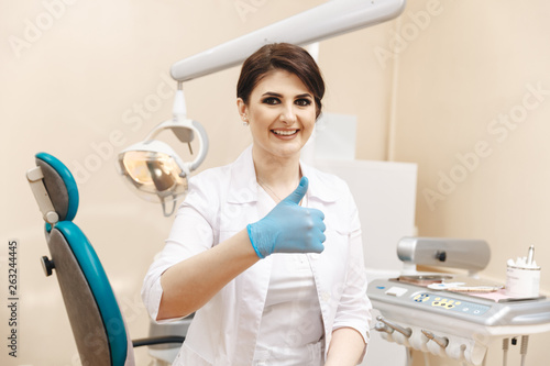 Closeup photo of female doctor in the dentist cabinet