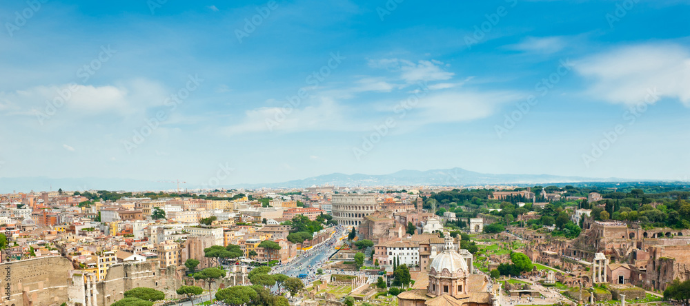 Beautiful aerial view. Panorama. Colosseum and Roman Forum in sunny spring day. Rome. Italy