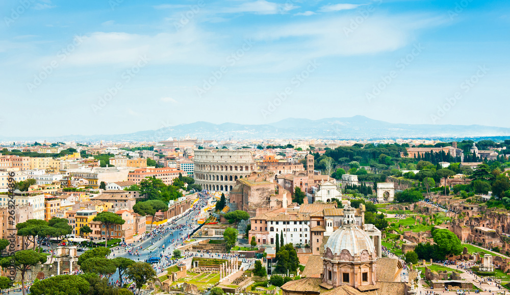 Scenic aerial view. Panorama. Colosseum and Roman Forum in sunny spring day. Rome. Italy