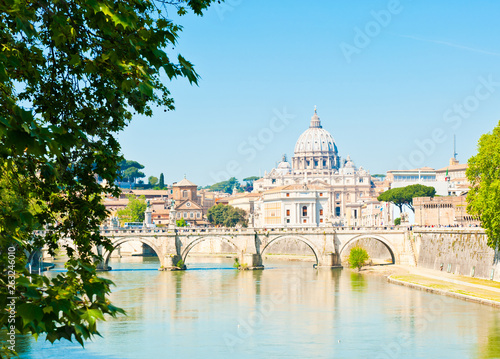 St. Peter's Basilica (Basilica Papale di San Pietro in Vaticano) and Tiber river. Sunny spring day in Rome, Italy