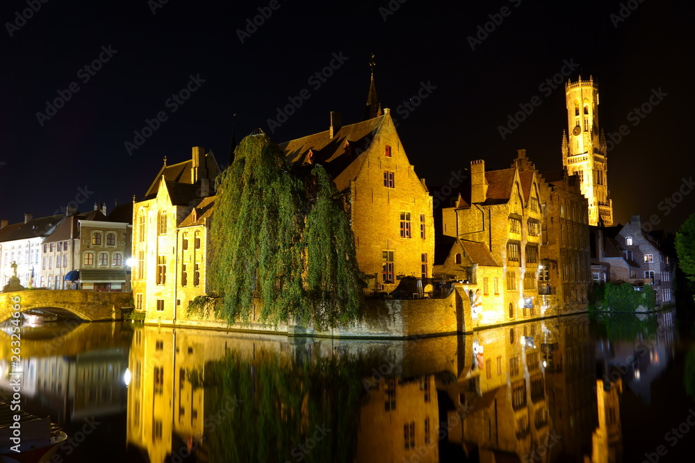 Night View of the Rozenhoedkaai (canal) in Bruges (Belgium) under backlight with the Belfry in the background