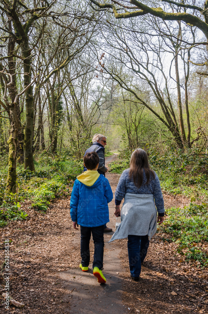 A family on a walk along country lanes at th evillage of Perton near Wolverhampton in South Staffordshire, UK