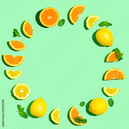 Round frame of oranges and lemons overhead view flat lay