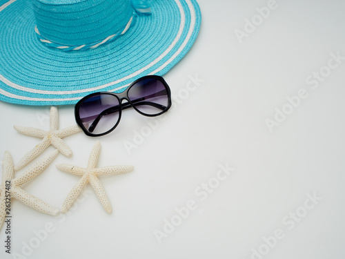 Summer background. Shells, straw hats, sunglasses