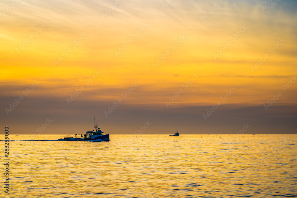 Lobster fishing boat scenery of Canada's Atlantic coast with a beautiful sky.