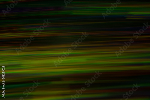 Blurry horizontal lines. Multicolor neon lights in motion on dark background. Bokeh lens flare glow.