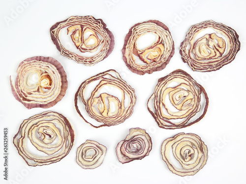 Dried salad onion slices on white background