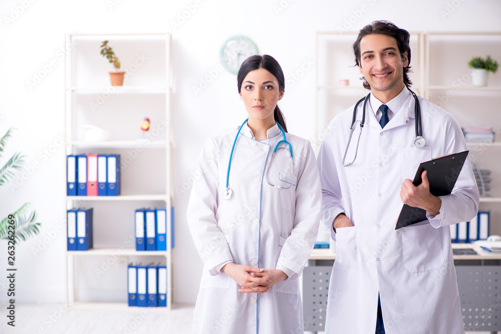 Two young doctors working in the clinic Two young doctors working in the clinic
