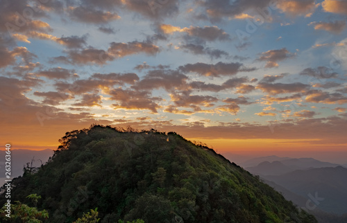 scenic mountain lined with alternates. The morning sun shines and fog covered the mountain. Doi KALHEPU, Mae Moei, Tak in Thailand