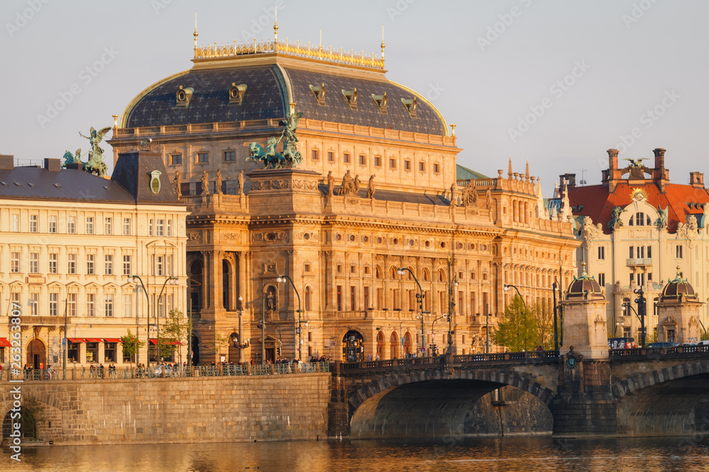 National Theater building in Prague, Czech Republic with Vltava River at sunset