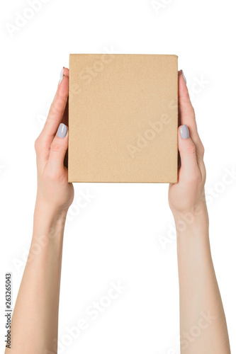 Small cardboard box in female hands. Top view. Isolate © somemeans