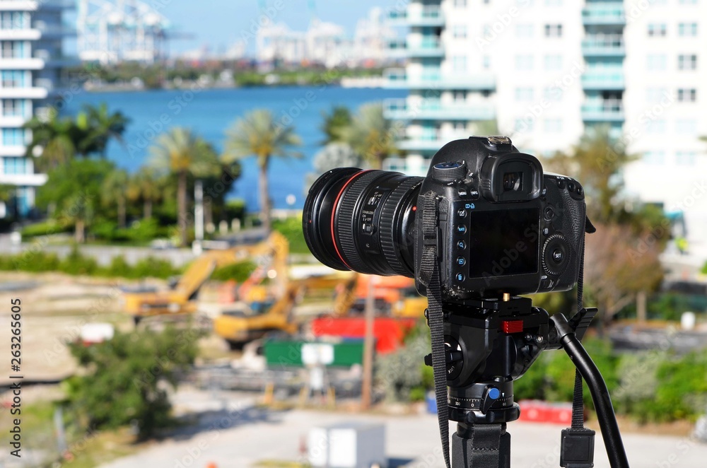 Single lens reflex digital camera against a muted Miami Beach,Florida scenic background