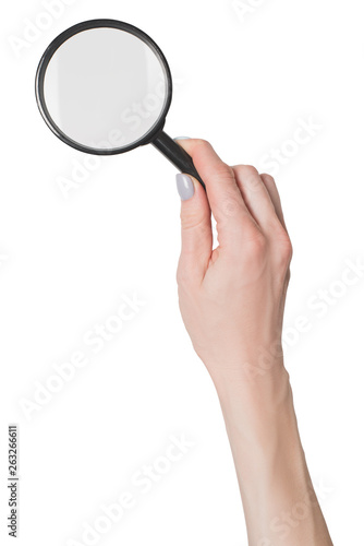 Female hand holding magnifier isolate on white background