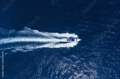 Yachts at the sea in Bali, Indonesia. Aerial view of luxury floating boat on transparent turquoise water at sunny day. Summer seascape from air. Top view from drone. Travel - image